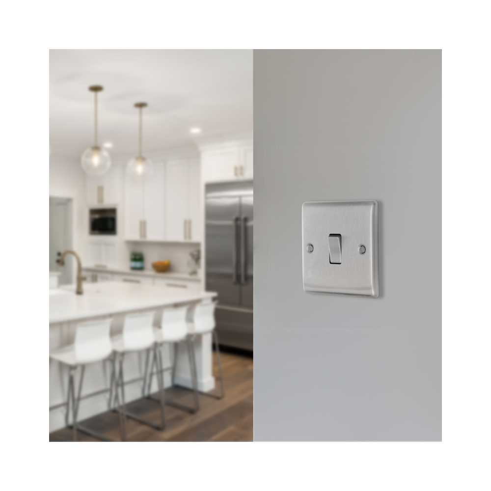 Metallic light switch on a white background kitchen setting