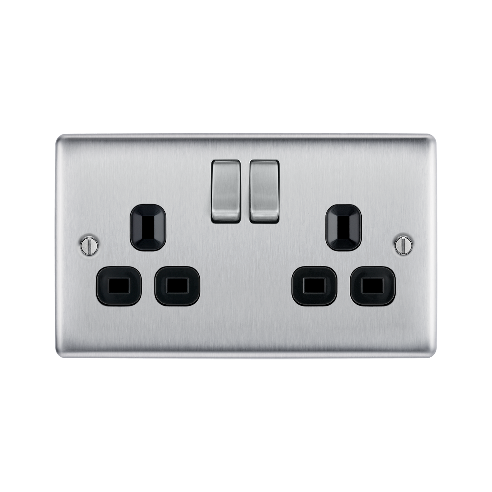 Metallic electrical socket with two black outlets and two silver rocker switches on a white background