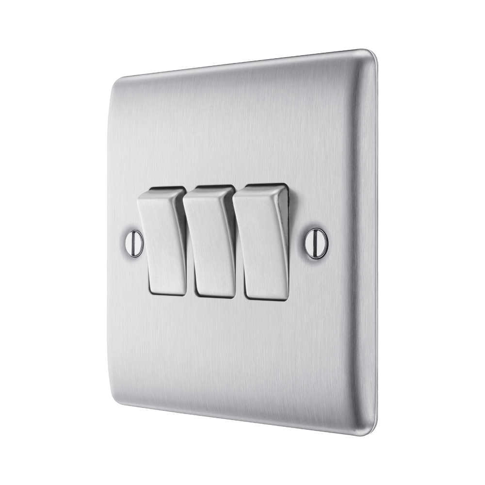 Metallic light switch panel with three toggle switches on a white background side
