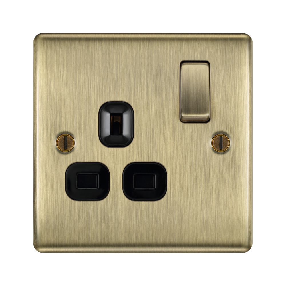 Brass electrical socket with black insert on a white background