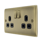 Antique brass double socket with black inserts on a white background angled view