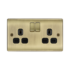 Antique brass double socket with black inserts on a white background