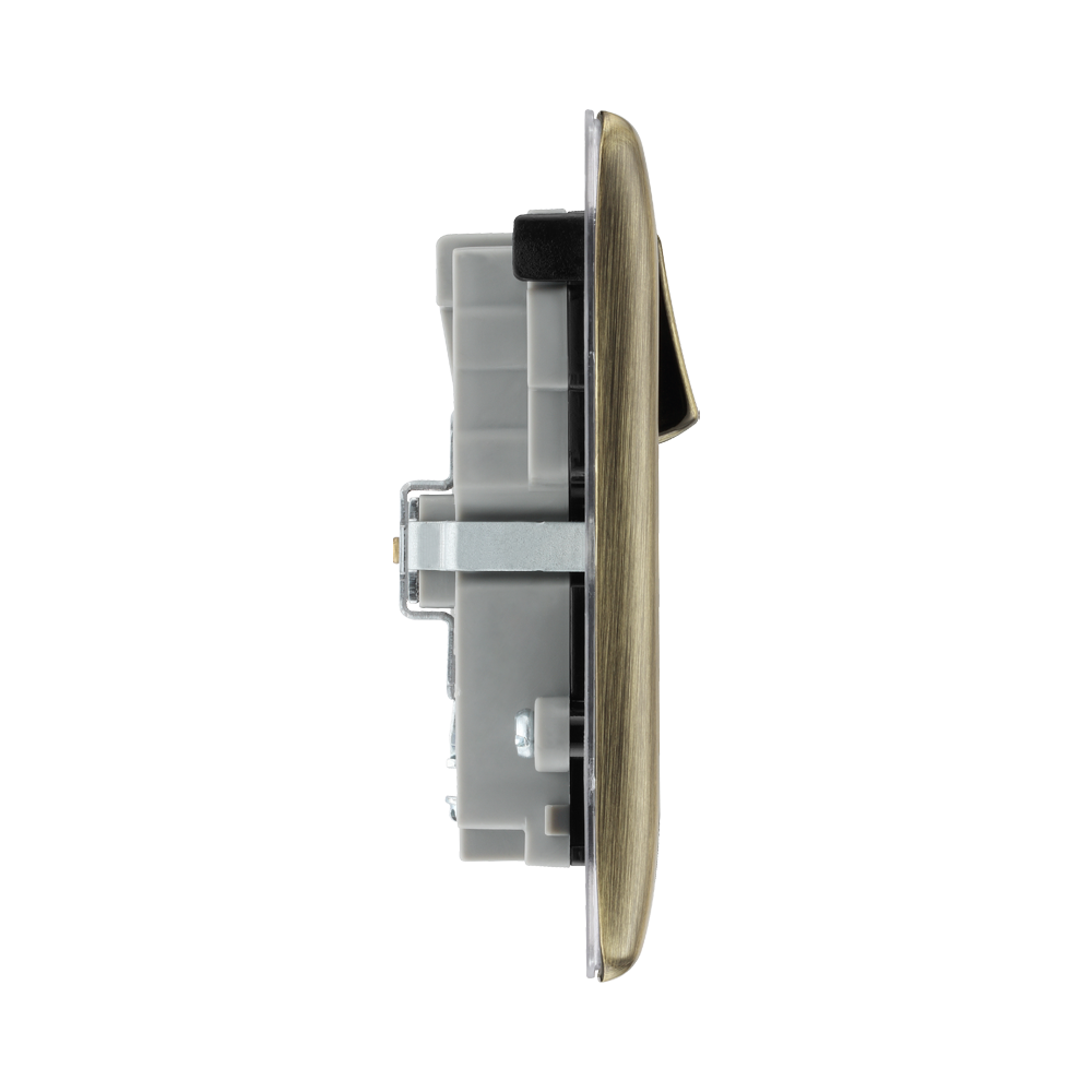 Light switch profile with brass front plate on a white background