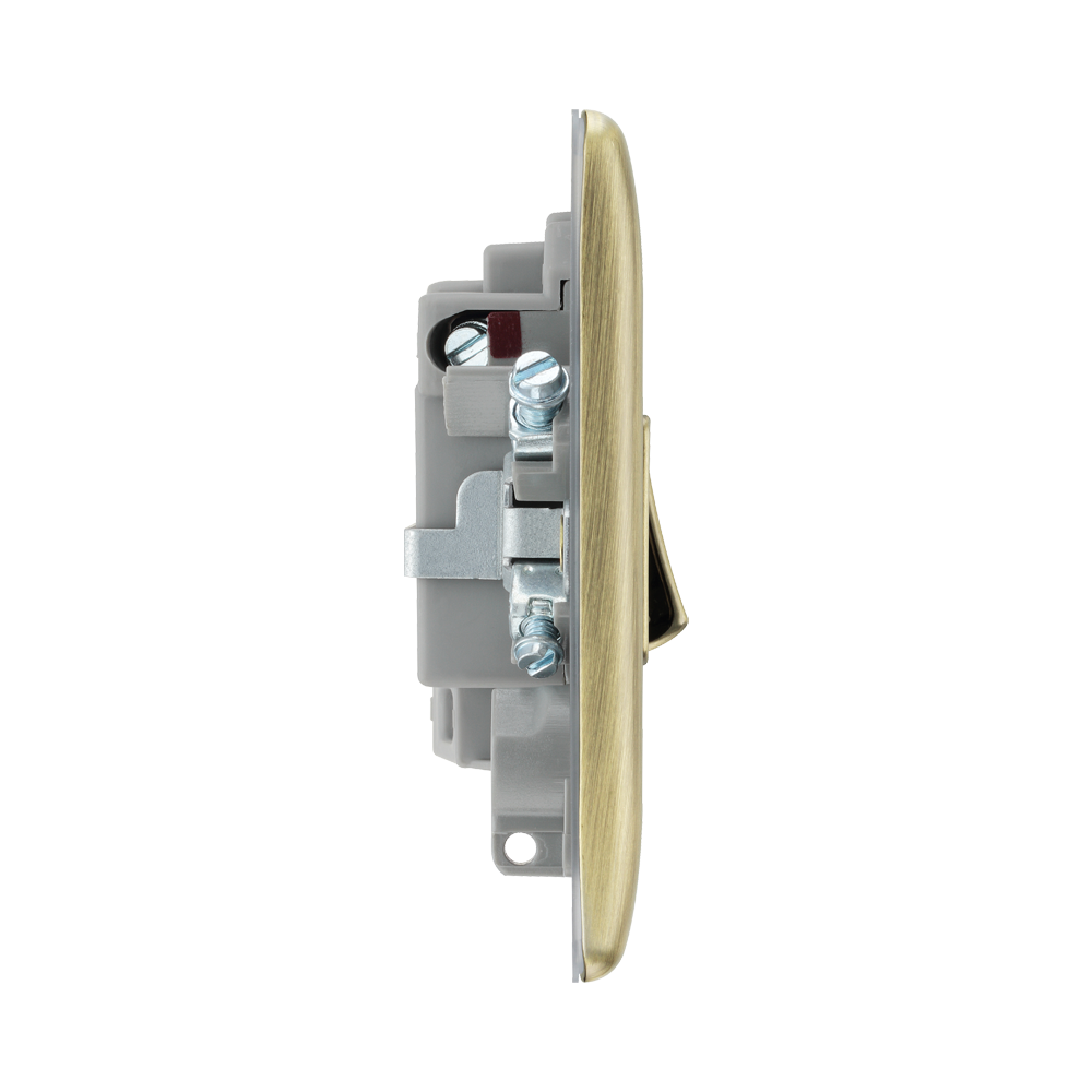Light switch profile with brass front plate on a white background