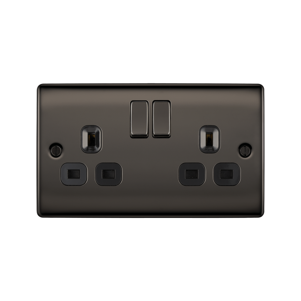 Black electrical socket with two plug sockets and two switches on a white background