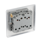 Metallic light switch panel with three toggle switches on a white background back