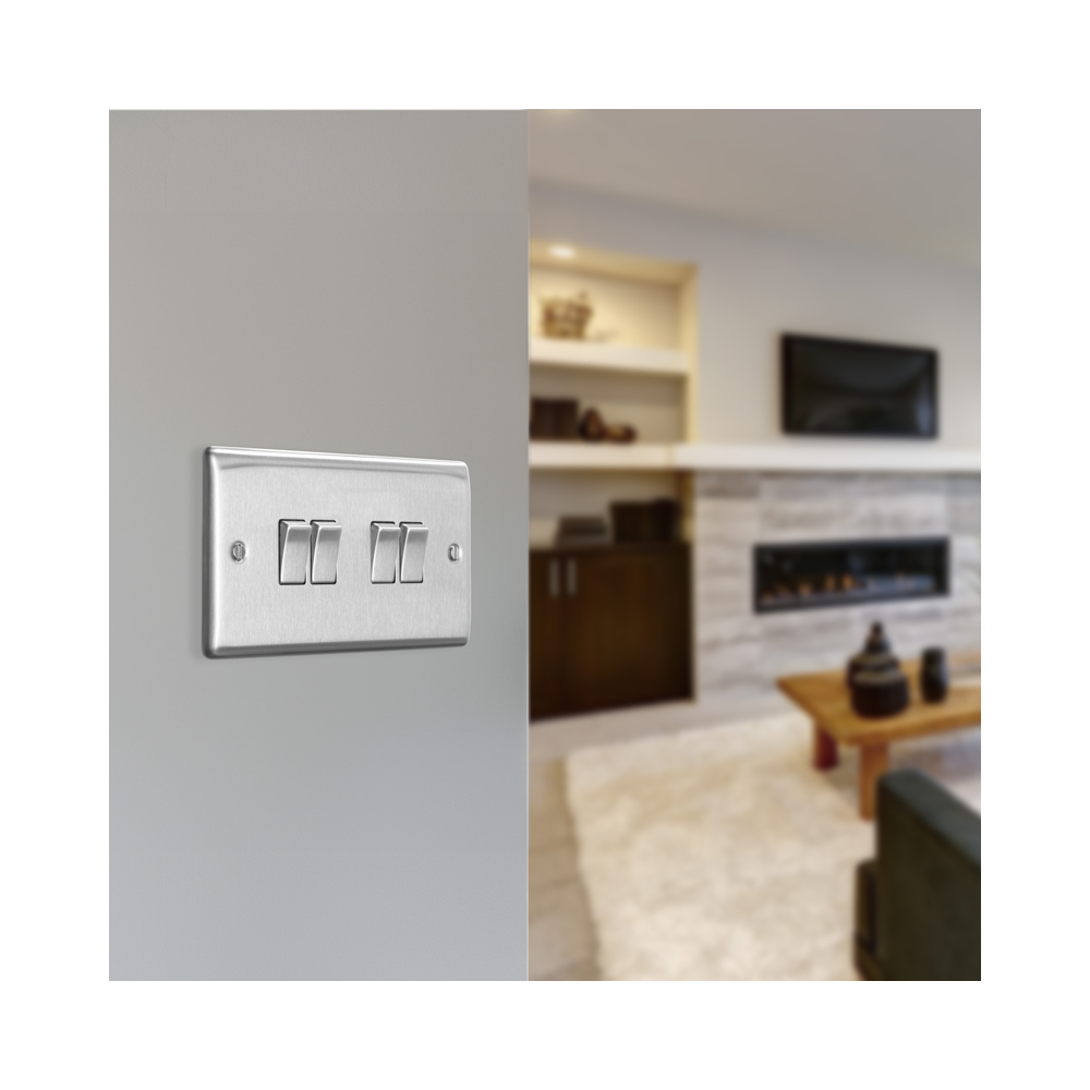 Metallic four-switch panel on a white background living room setting
