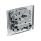 Metallic light switch with two toggle switches on a white background back